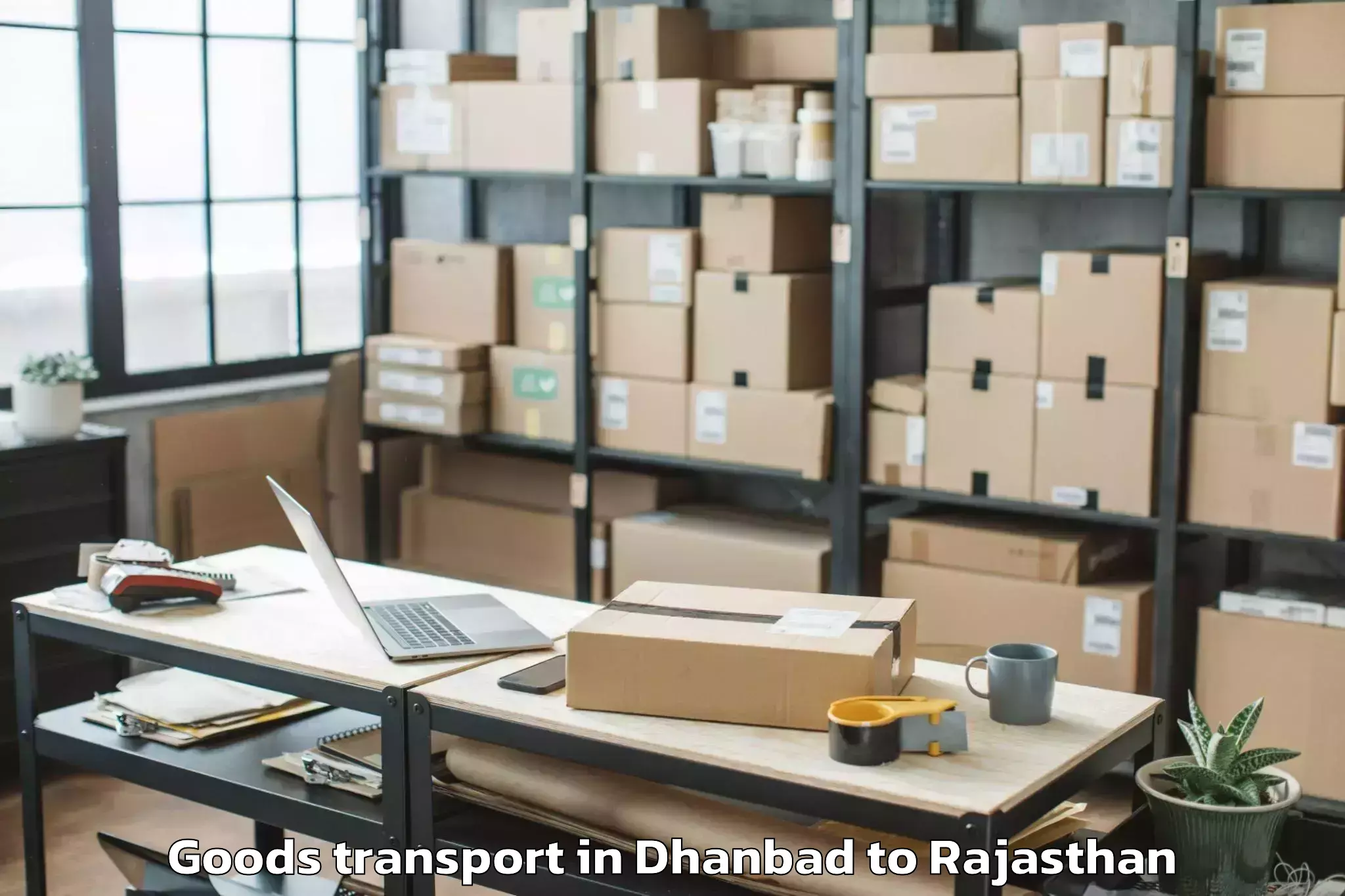 Affordable Dhanbad to Central University Of Rajastha Goods Transport